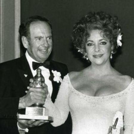 Elizabeth and her then-boyfriend, Victor carrying award together
